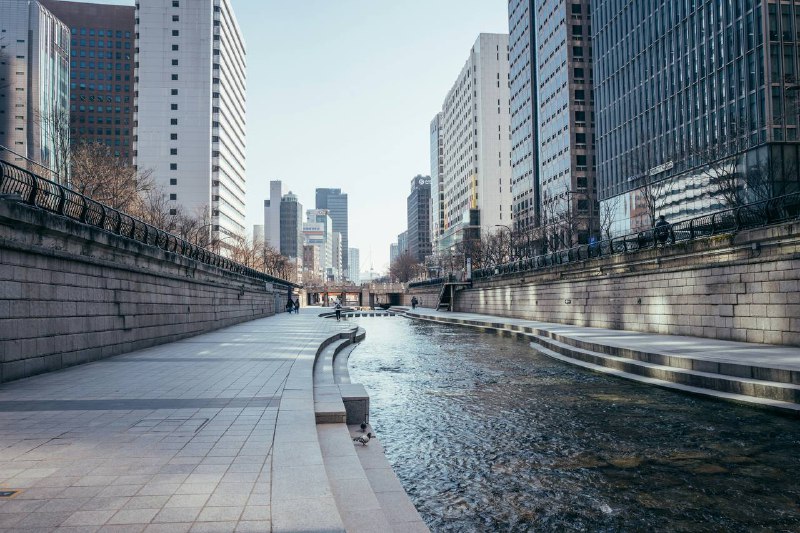 Serene view of Cheonggyecheon Stream with modern buildings